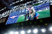 Country music singer-songwriter Ingrid Andress, 32, sings the national anthem before the MLB...