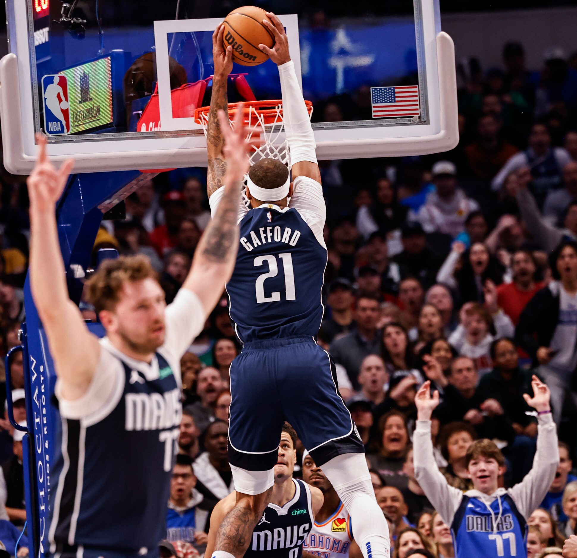 Dallas Mavericks guard Luka Dončić (77) celebrates as Dallas Mavericks center Daniel Gafford...