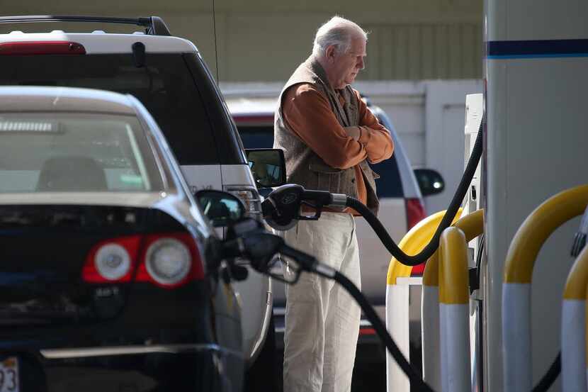 A customer pumps gasoline into his car