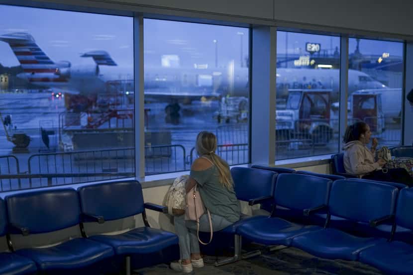 CHARLOTTE, NC - MAY 20:  A passenger waits to board an American Airlines flight to Roanoke,...