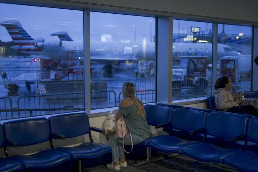 CHARLOTTE, NC - MAY 20:  A passenger waits to board an American Airlines flight to Roanoke,...