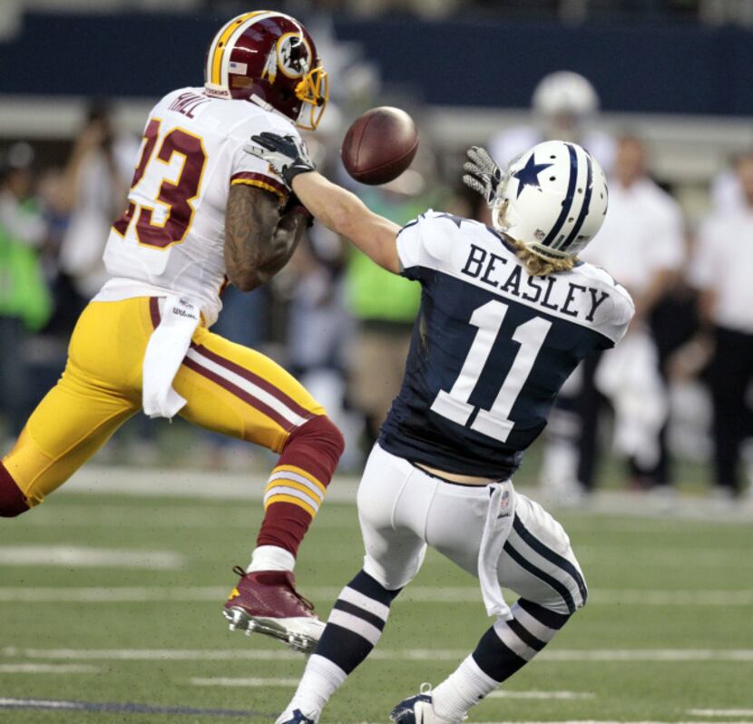 Washington Redskins cornerback DeAngelo Hall (23) intercepts a pass intended for Dallas...