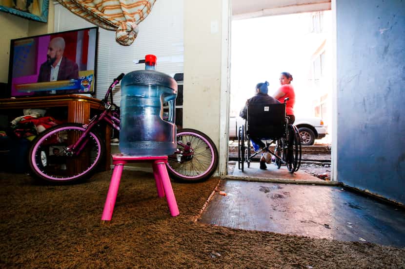 A water jug sat on a stool inside Modesta Gonzalez’s home at the Villas del Solamar...