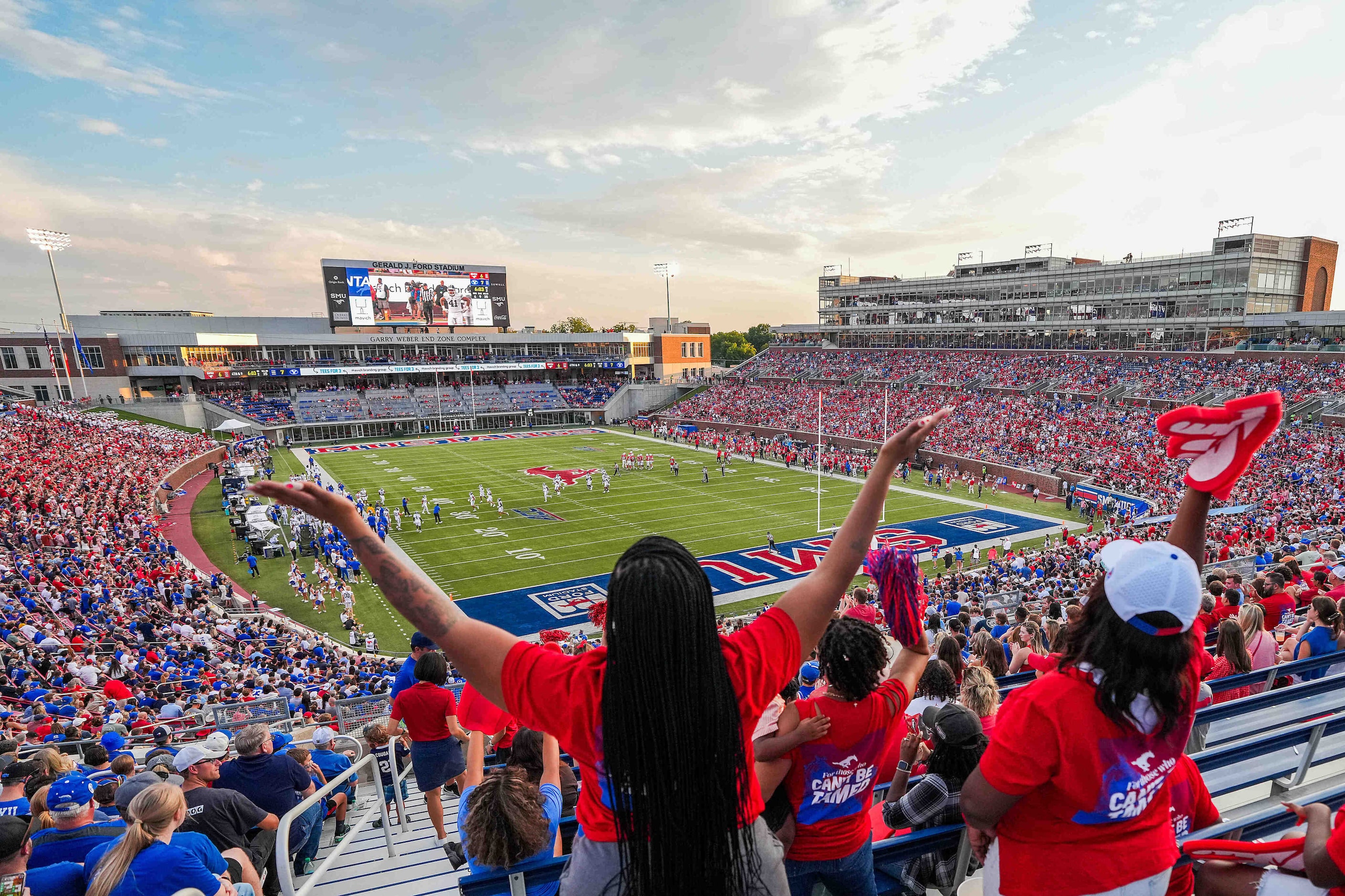 SMU fans cheer a field goal by place kicker Collin Rogers during the first half of an NCAA...