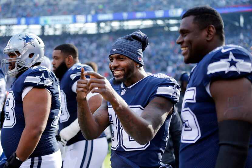 Dallas Cowboys wide receiver Dez Bryant (88) keeps it lighthearted on the sideline before...