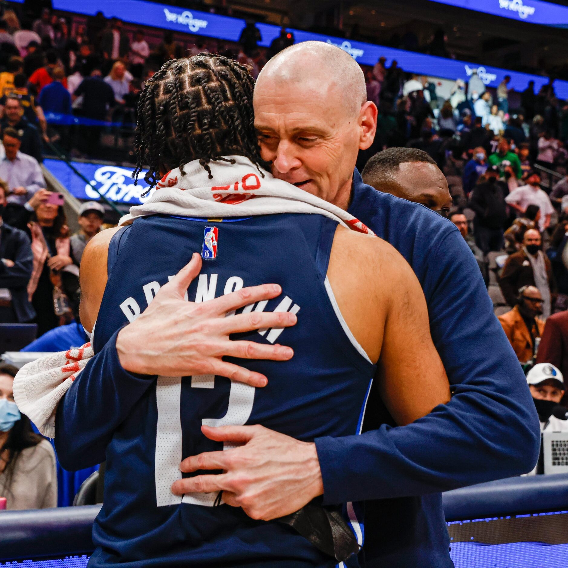 Indiana Pacers coach Rick Carlisle hugs Dallas Mavericks guard Jalen Brunson (13) after the...