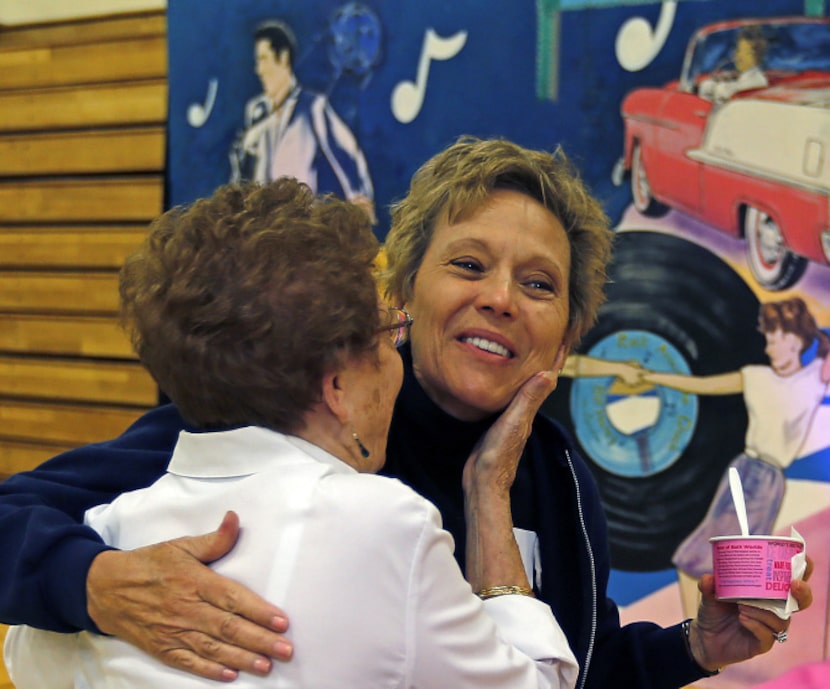 Carman Moran (right) of Addison gets a hug from Doreen Cluck of Addison at the City of...