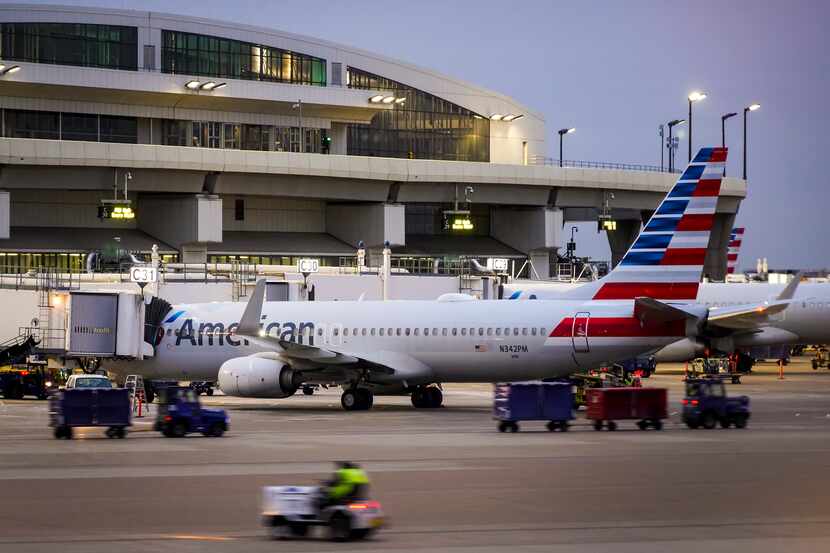 American Airlines jets were parked at Terminal C gates at DFW International Airport on Jan....