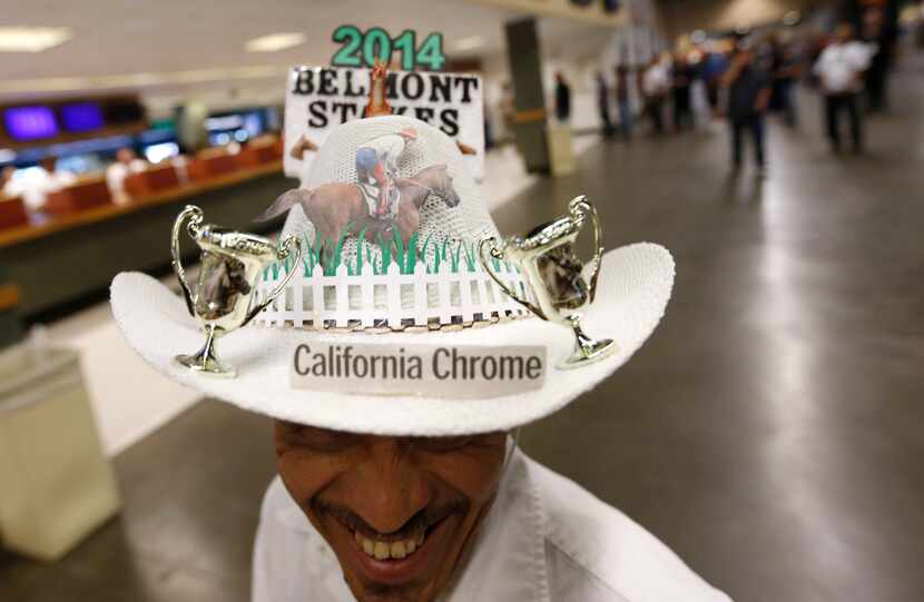 Edwin Collazo, of the borough of Brooklyn, in New York, wears a hat paying tribute to...