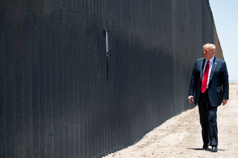 President Donald Trump marks the 200th mile of border wall at the international border with...