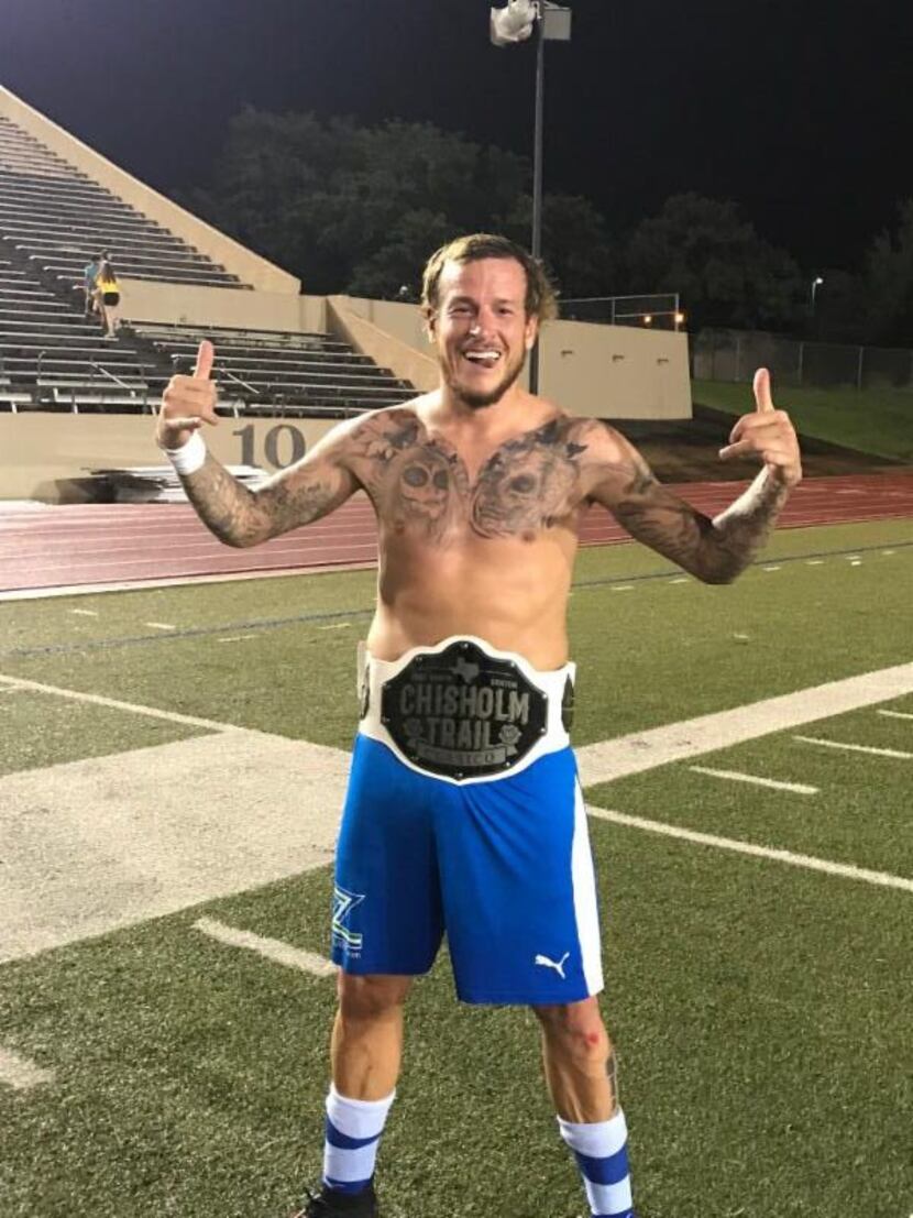 Jamie Lovegrove of the Fort Worth Vaqueros shows off the Chisholm Trail Clásico Belt after...