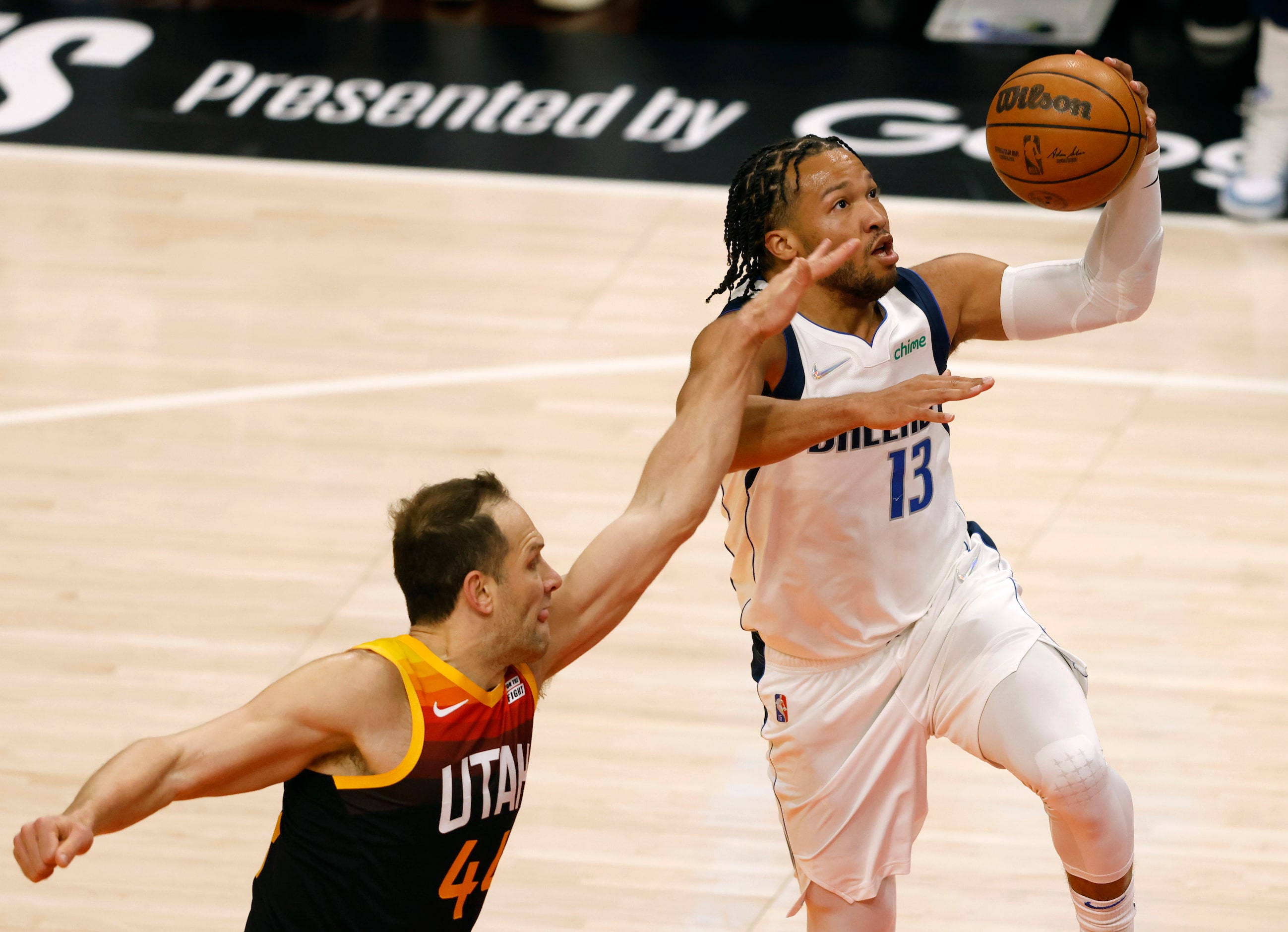 Dallas Mavericks guard Jalen Brunson (13) goes up for a layup as Utah Jazz forward Bojan...