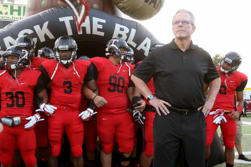 Euless Trinity coach Steve Lineweaver and his team prepare to take the field against Abilene...
