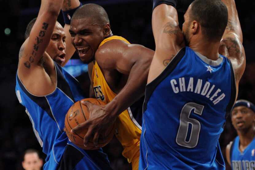 Andrew Bynum of the Los Angeles Lakers attempts to split the defense of Dallas' Shawn Marion...
