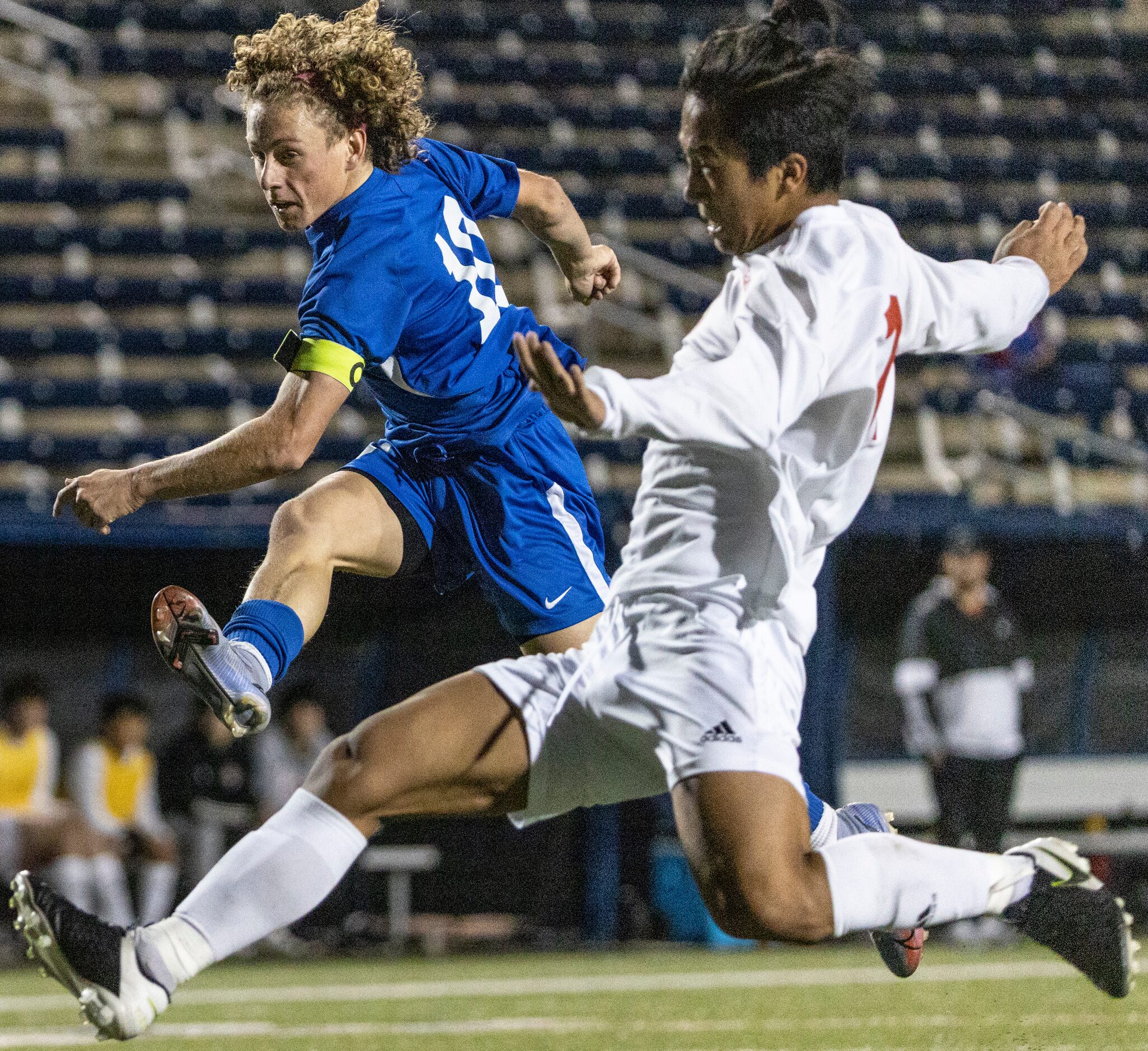 Allen High School Matthew Sanchez kicks the ball over Lake Highlands High School Cung Lian...