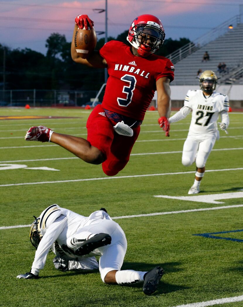 Kimball High RB Cortavious Smith (3) takes the high road to a first down during the first...