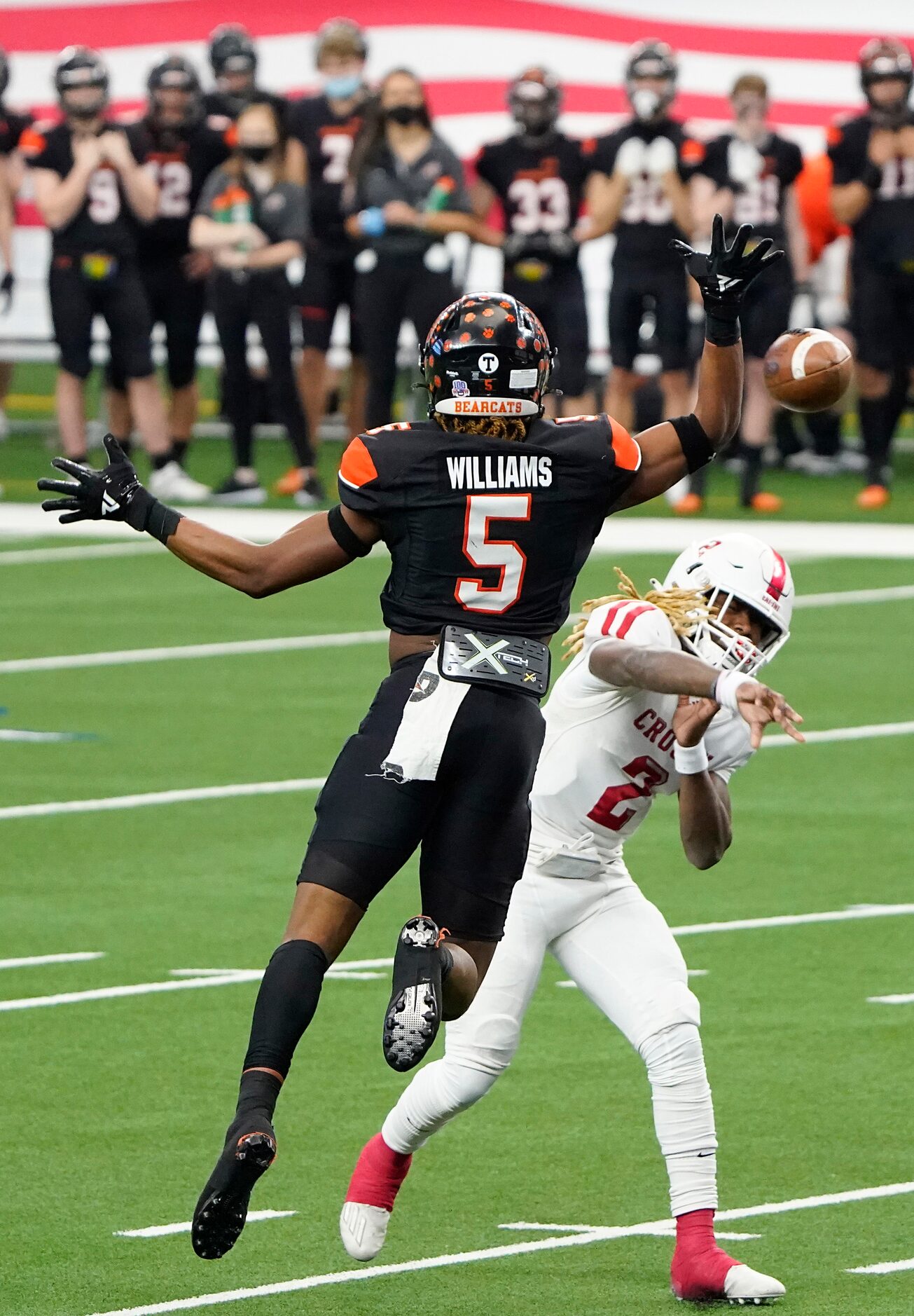 Crosby Deniquez Dunn (2) throws a touchdown pass under pressure from Aledo linebacker Ryan...