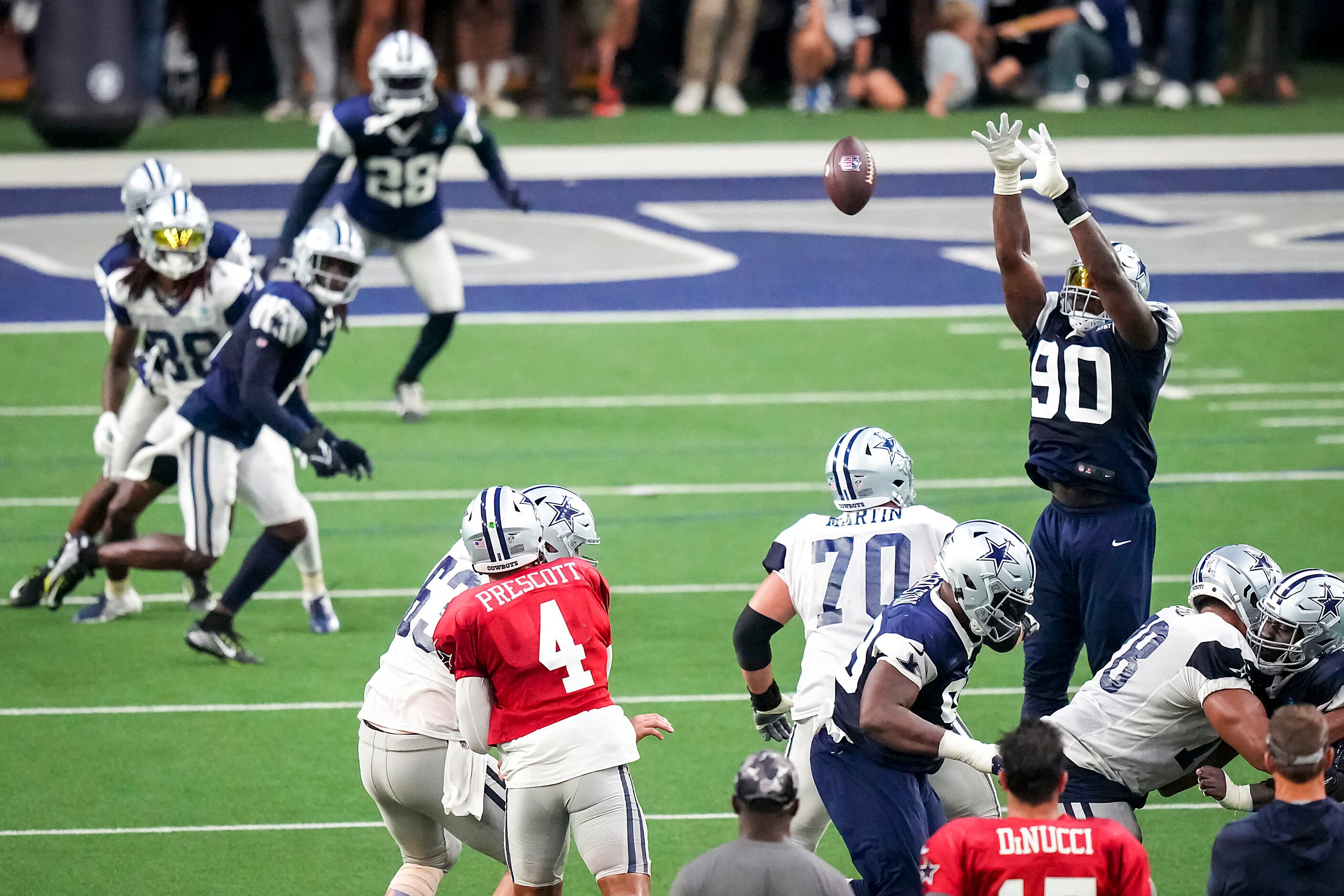 Dallas Cowboys defensive end DeMarcus Lawrence (90) knocks down a pass by quarterback Dak...