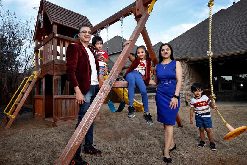 Harshal Bauskar, his wife Shital and three children Amayra (center), Kiaan (right), and...