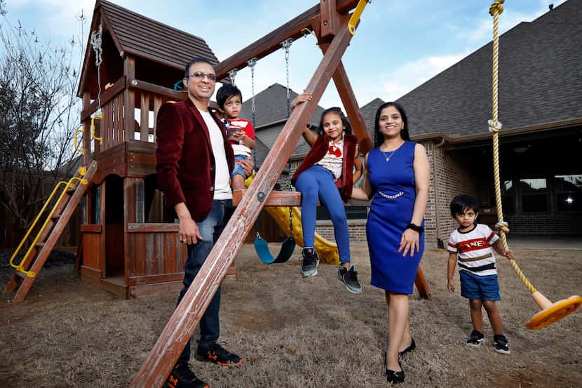 Harshal Bauskar, his wife Shital and three children Amayra (center), Kiaan (right), and...