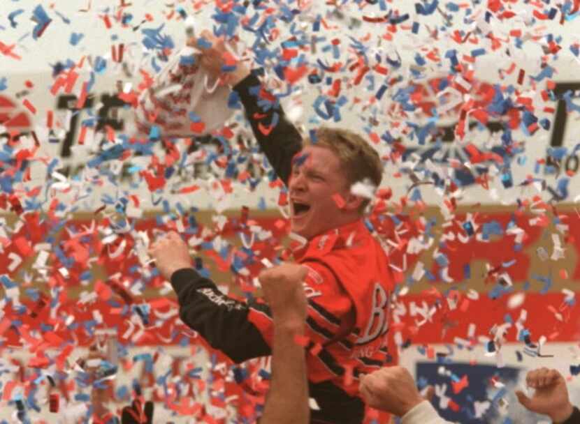 Driver Dale Earnhardt Jr. celebrates after winning his first Winston Cup race at the Direct...