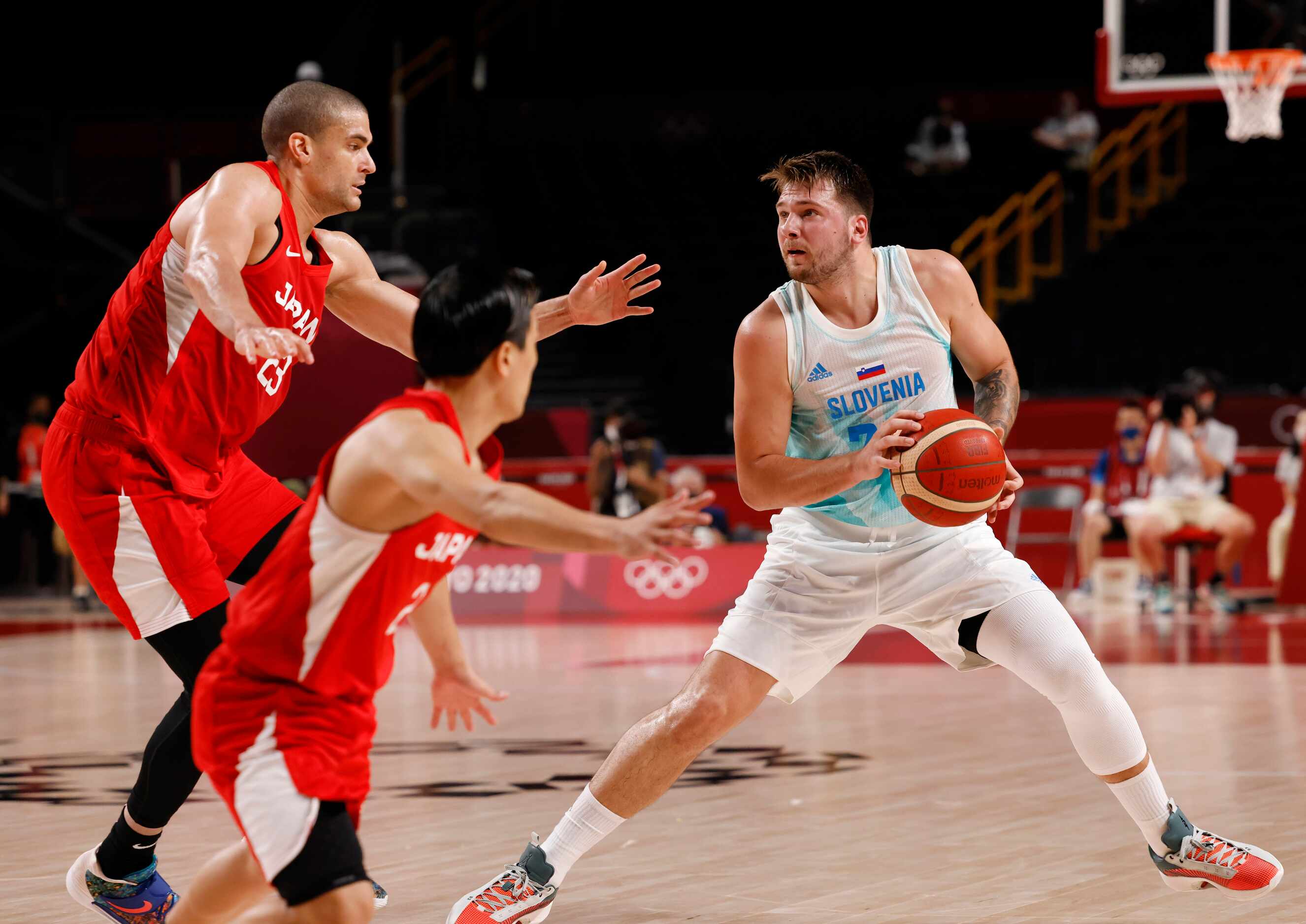 Slovenia’s Luka Doncic (77) steps back for a three point attempt as Japan’s Gavin Earl...