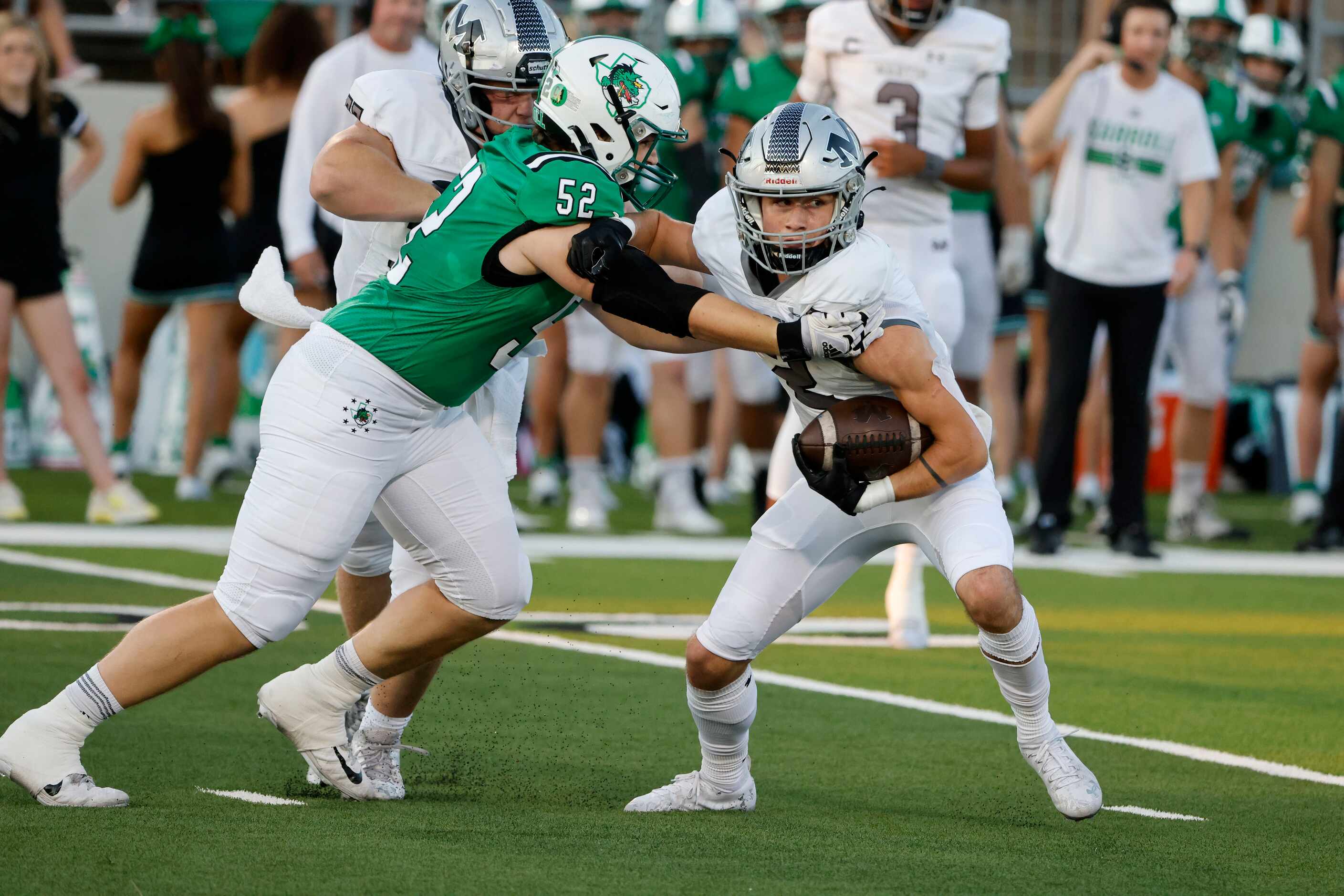 Southlake defender Cade Parks (52) stops Arlington Martin receiver Trey Cochran (2) during a...