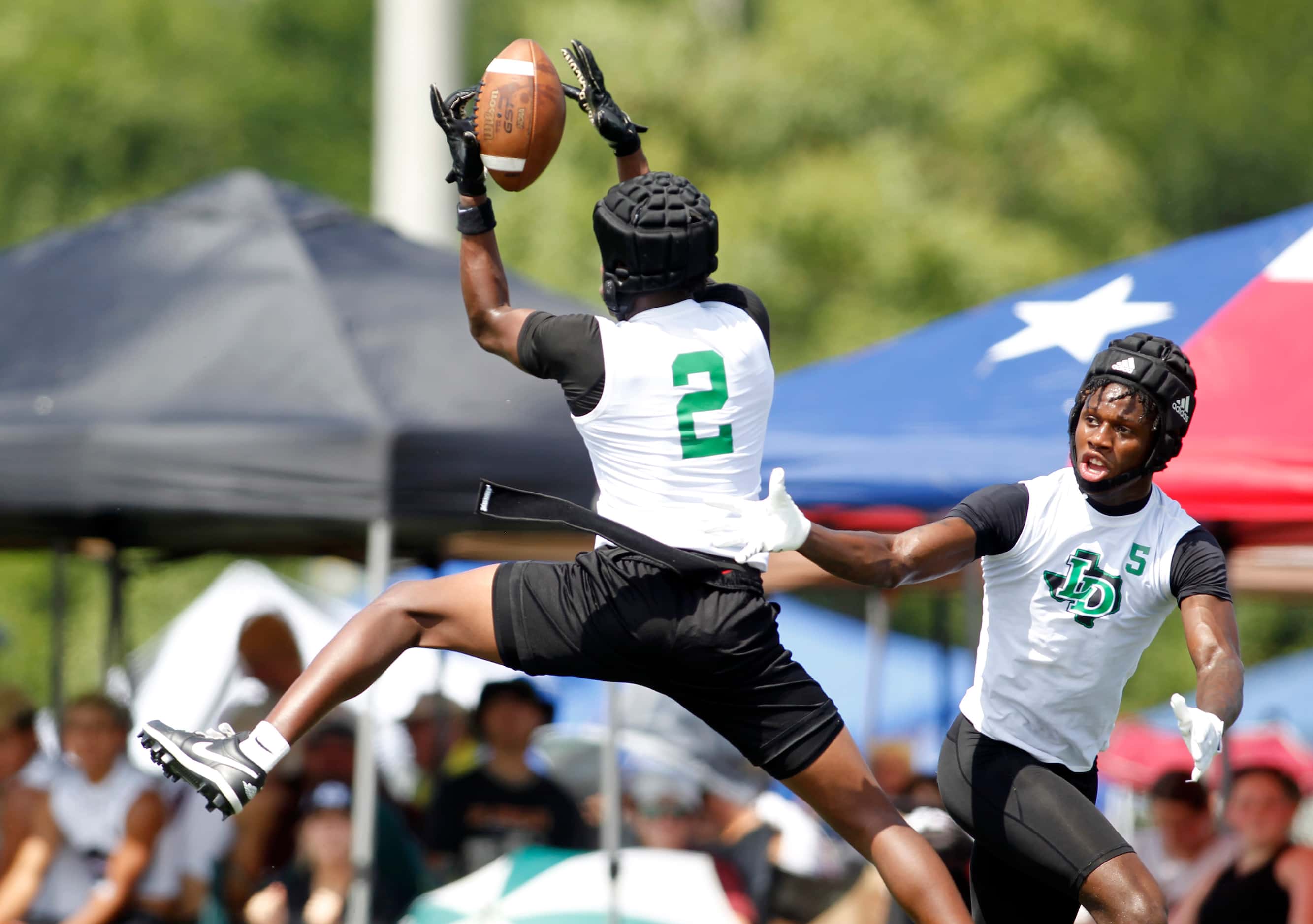 Lake Dallas defensive back DJ Hicks (2) leaps to pull down an interception to help seal the...
