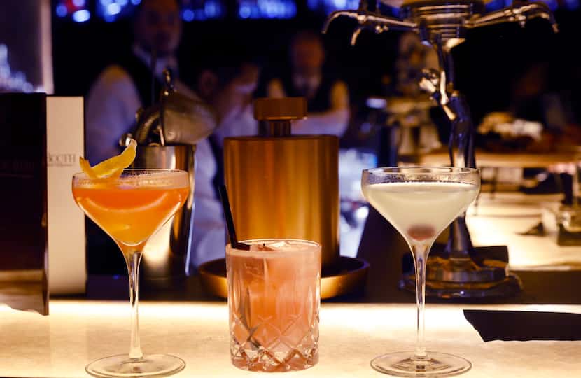 Drinks are served up at the main bar during a press event at Red Phone Booth, a speakeasy in...