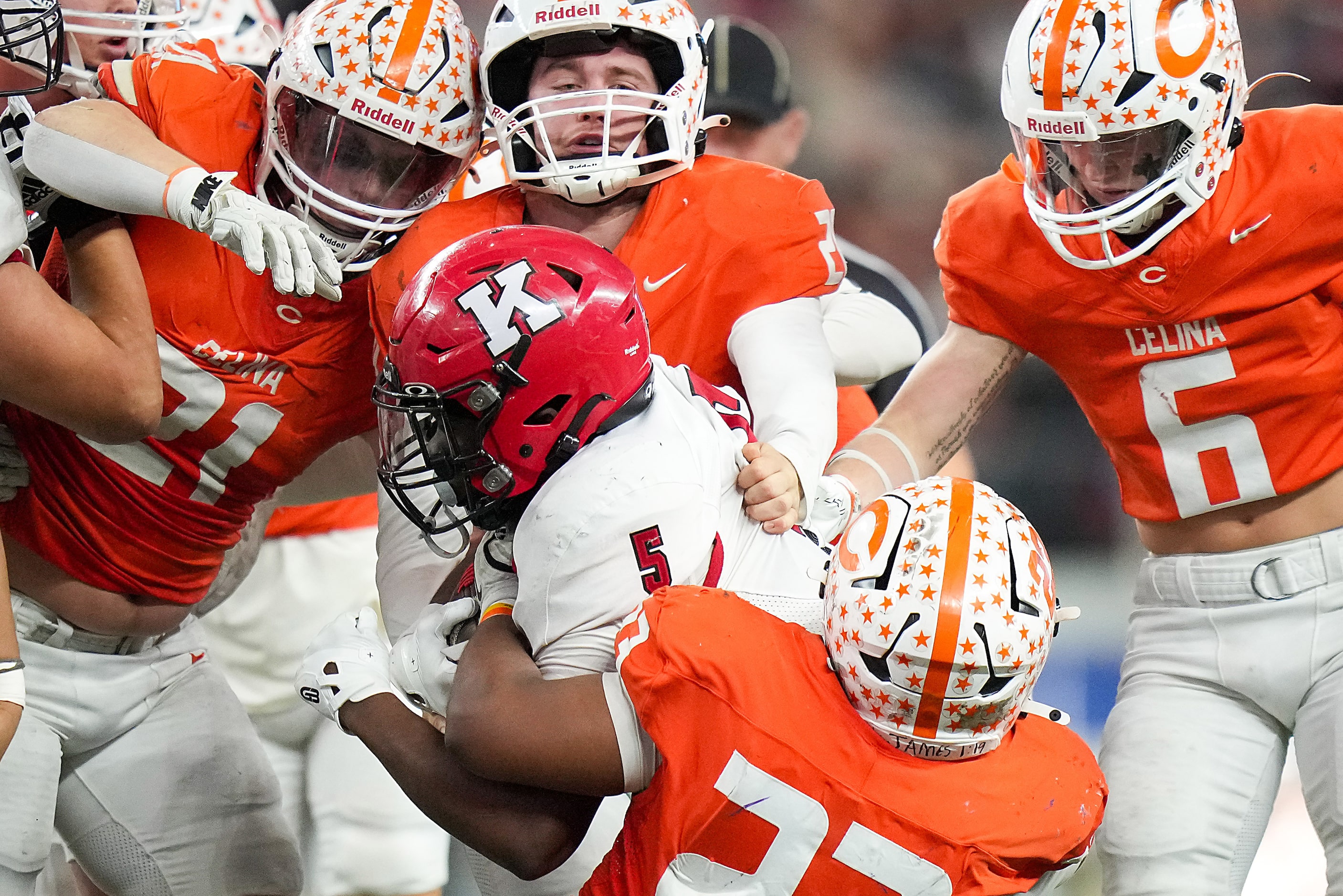 Kilgore Isaiah Watters (5) is brought down by Celina's Cameron Lucas (23) during the Class...