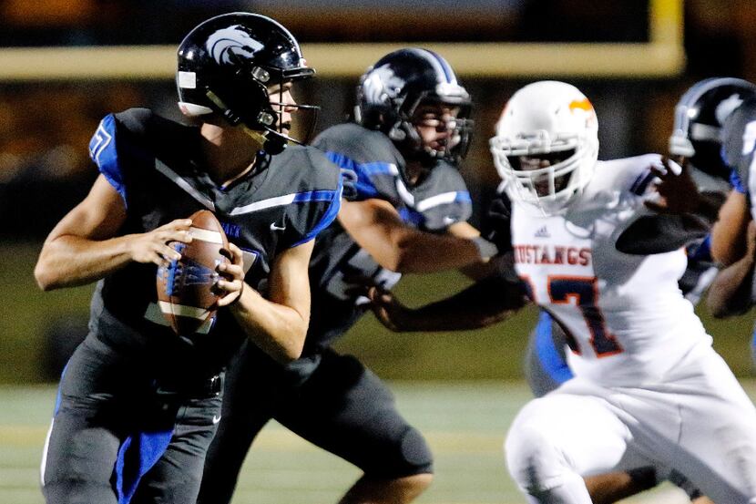 Plano West High School quarterback Jake Sweeney (17) scrambles during the first half as...