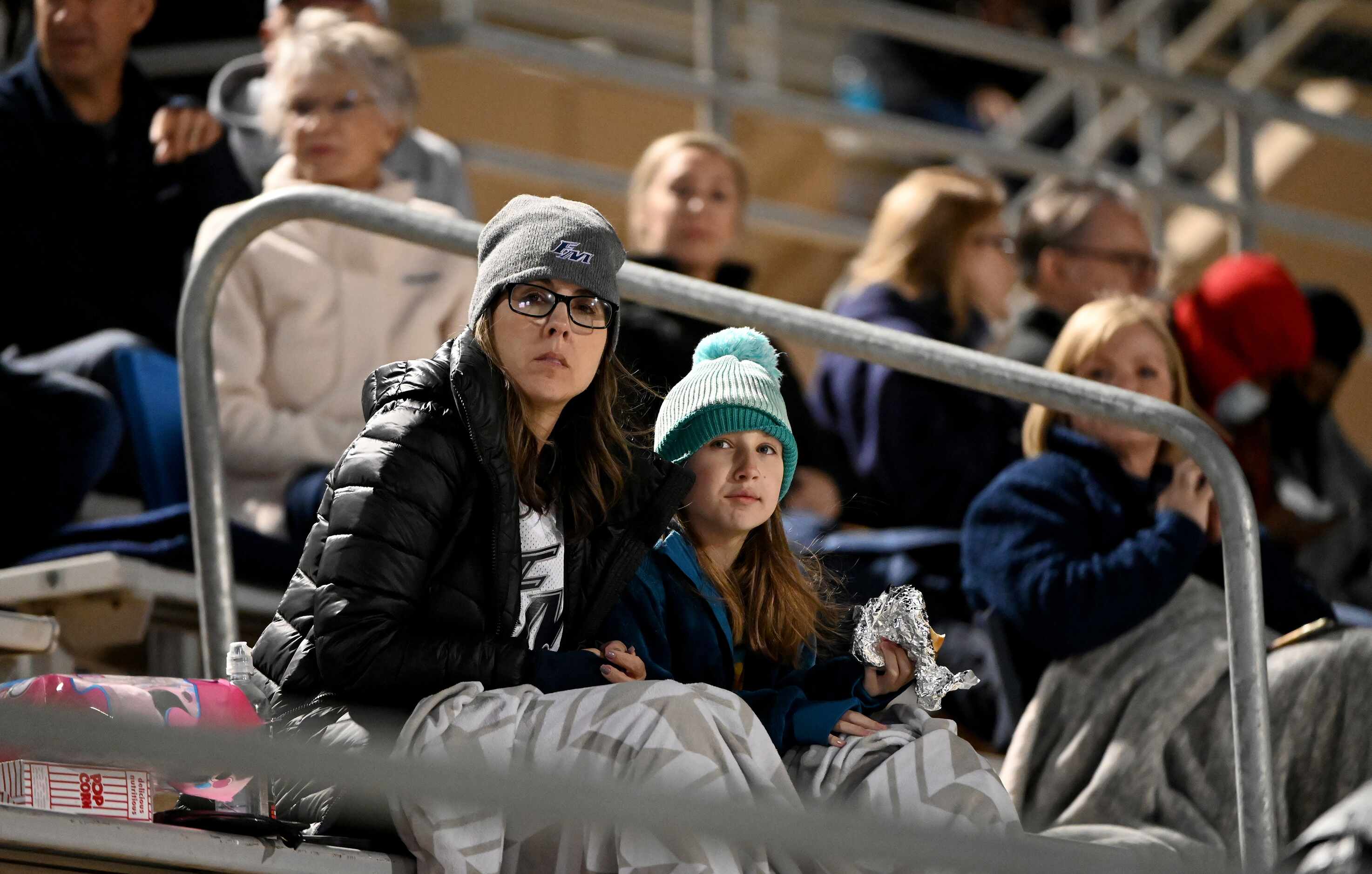 Flower Mound fans try to stay warm in the first half of a high school football game between...