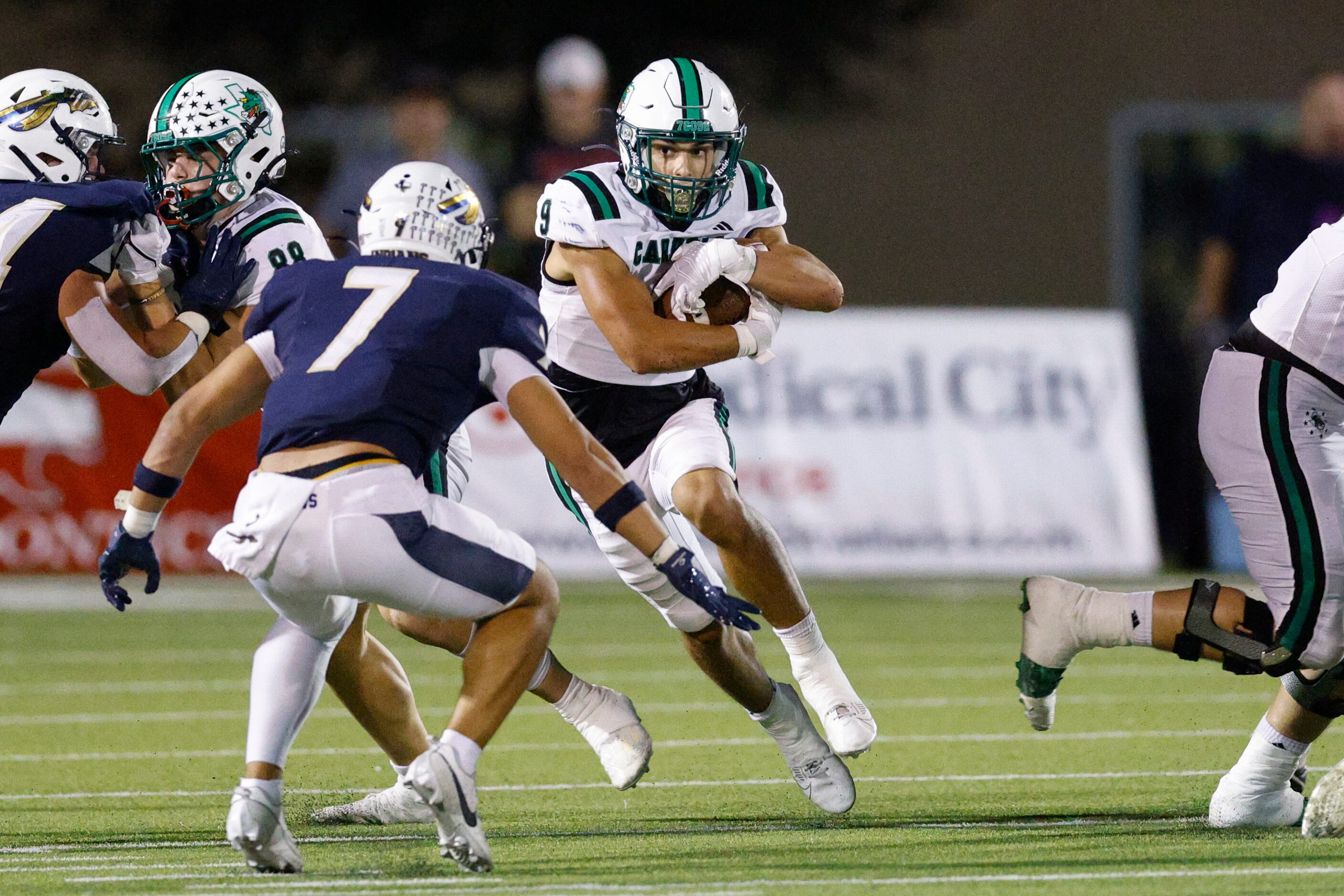 Southlake Carroll running back Riley Wormley (9) runs towards Keller defensive back Ryan...