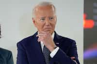 President Joe Biden listens during a visit to the D.C. Emergency Operations Center, Tuesday,...