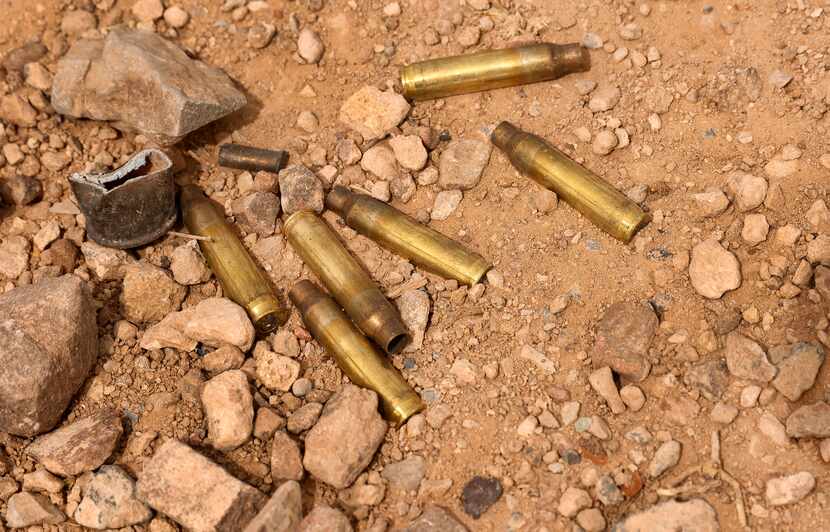 Used gun shell casings lie in the gravel at a public range in Sierra Blanca, Texas, March...
