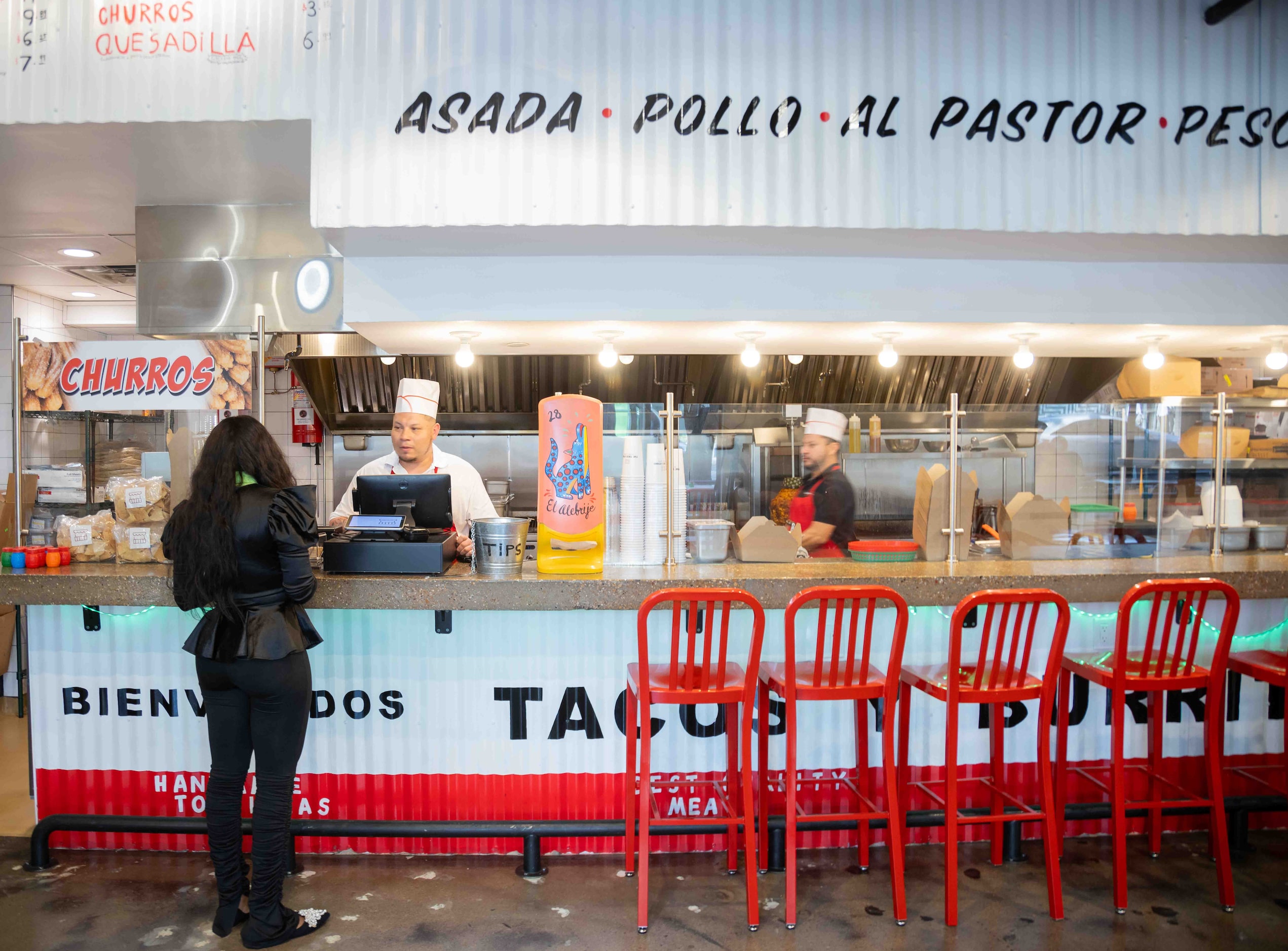 A customer places an order at Taco Stand located in Uptown Dallas on Wednesday, March 6,...