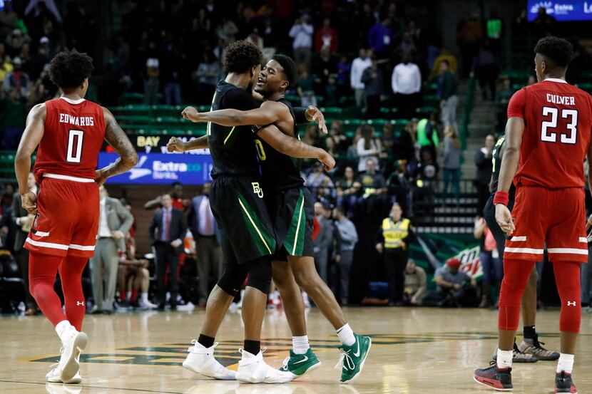 Texas Tech's Kyler Edwards (0) and Jarrett Culver (23) walk to the bench as Baylor's Freddie...