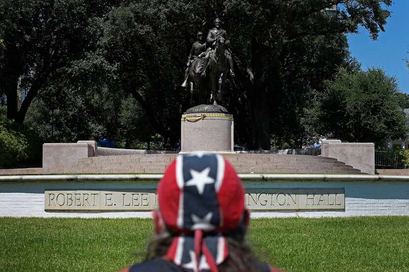 Johnny Carpenter looks at the statue of Robert E. Lee that still stands in Oak Lawn almost a...