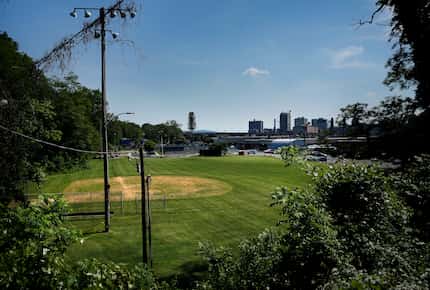Part of the Harrisburg, Pa., skyline is seen beyond Sunshine Park, the field where Dallas...