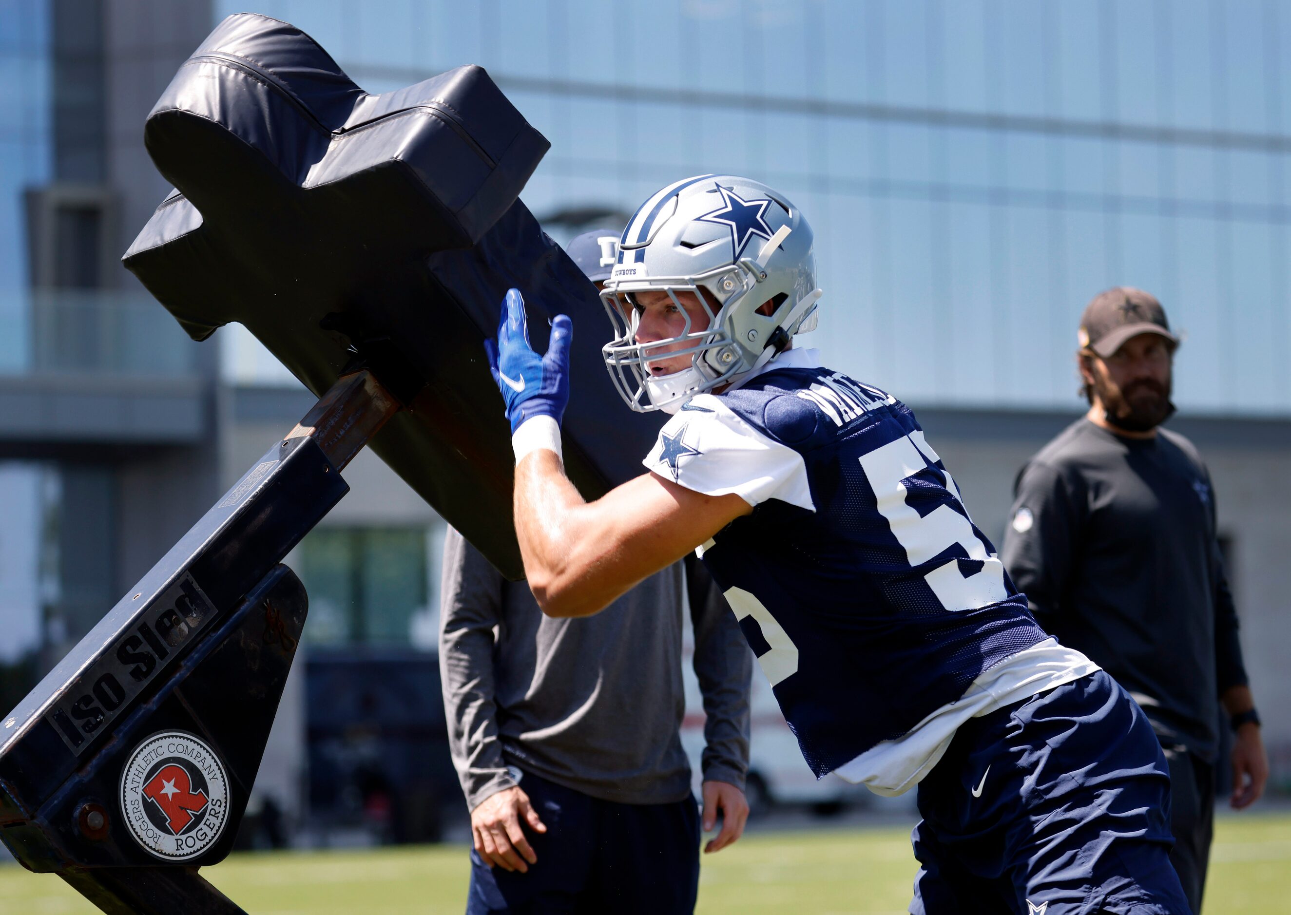 Dallas Cowboys linebacker Leighton Vander Esch (55) hits the blocking dummies during...