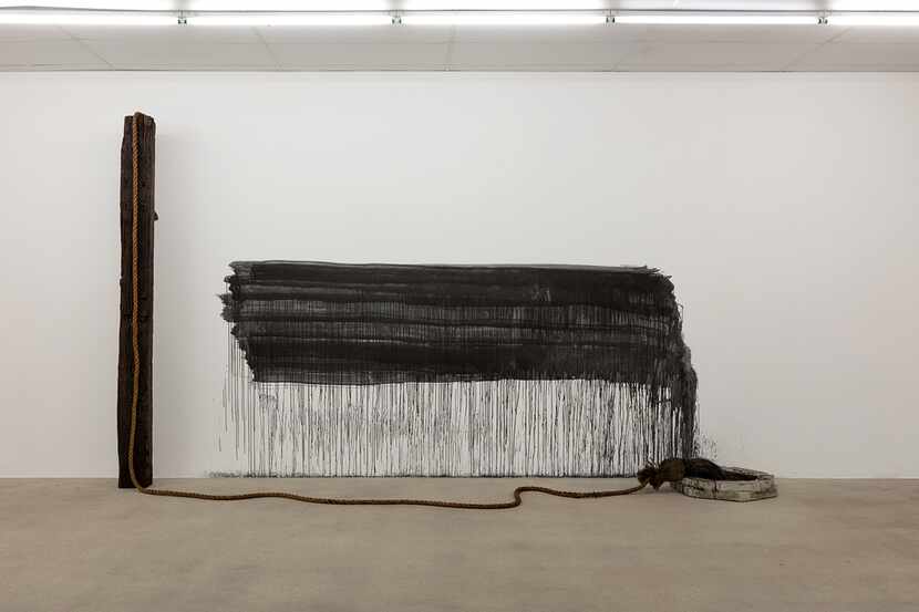 "Untitled (brush, railroad tie, rope, charcoal, concrete, ink)" is among Oshay Green's works...