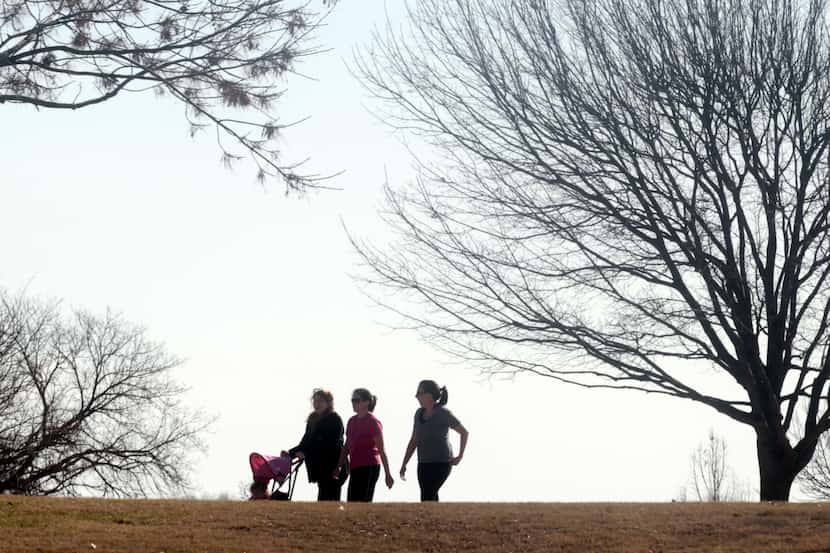 People enjoyed the sunshine and warm weather as they walked around White Rock Lake in Dallas...