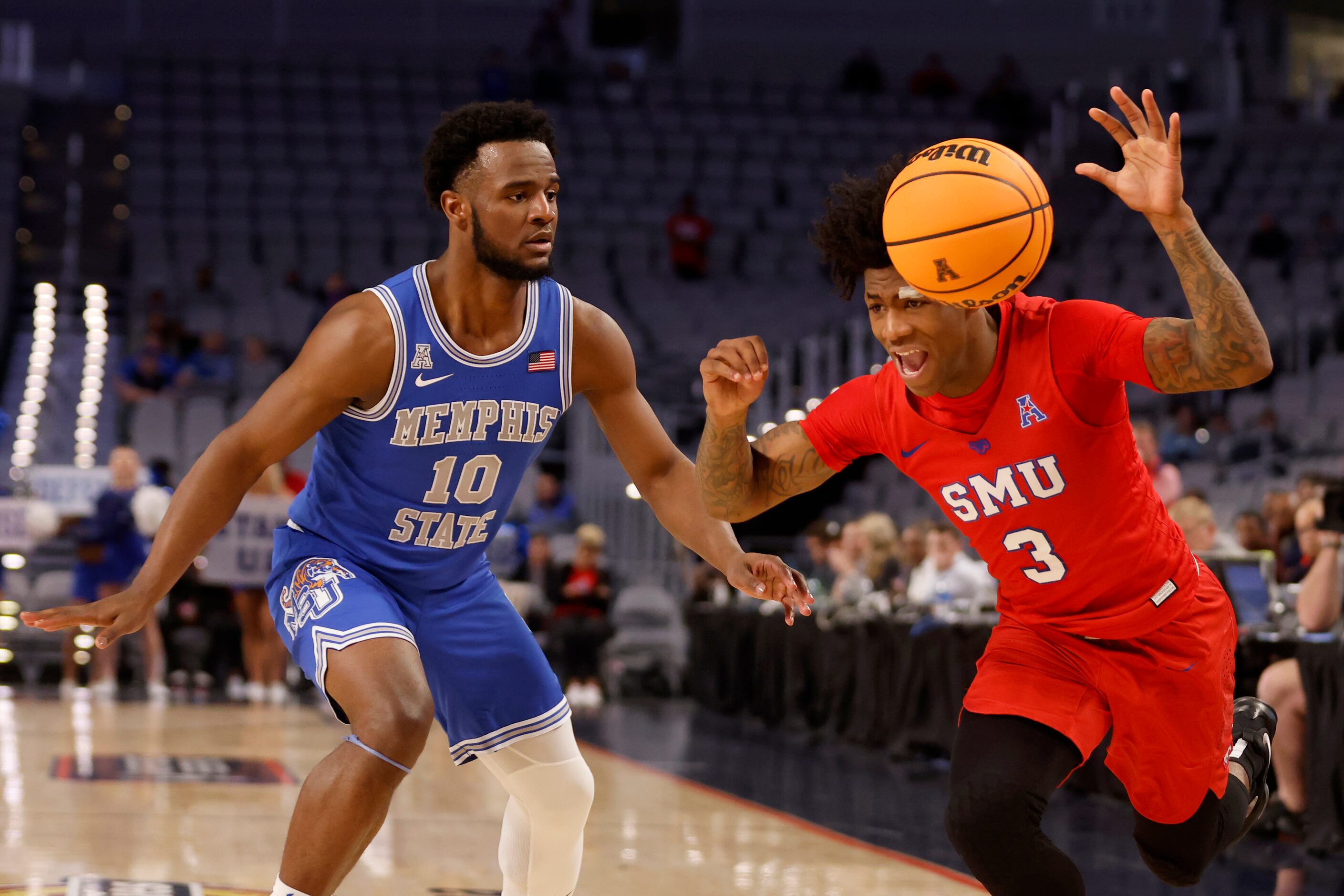 SMU guard Kendric Davis (3) is fouled by Memphis guard Alex Lomax (10) during the second...