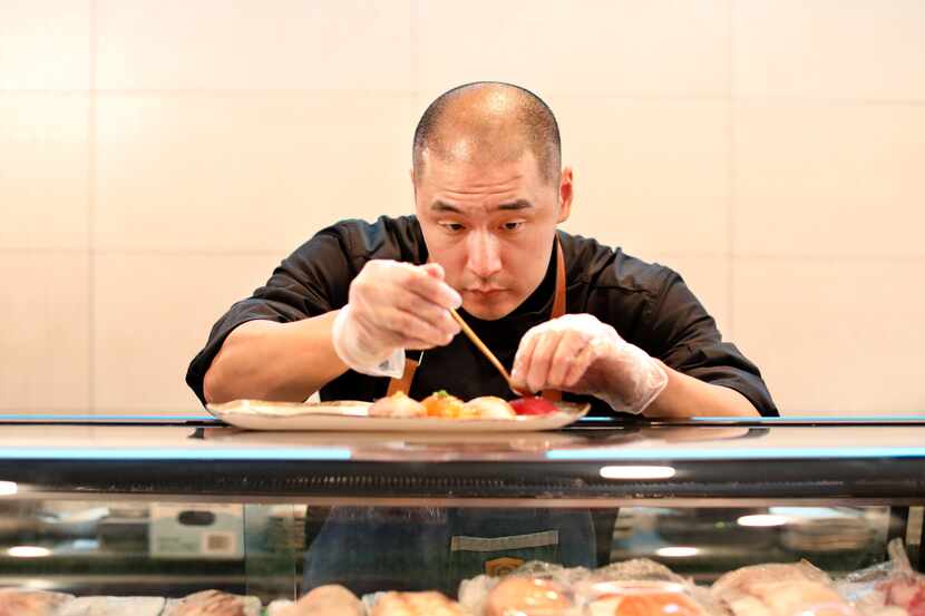 William Yoon prepares a "chef’s special" Nigiri Flight at Kaiyo in Dallas. The restaurant on...