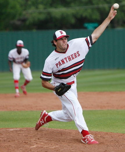 Hillcrest pitcher Ryan Prager (10) delivers a pitch to a Woodrow Wilson batter during the...