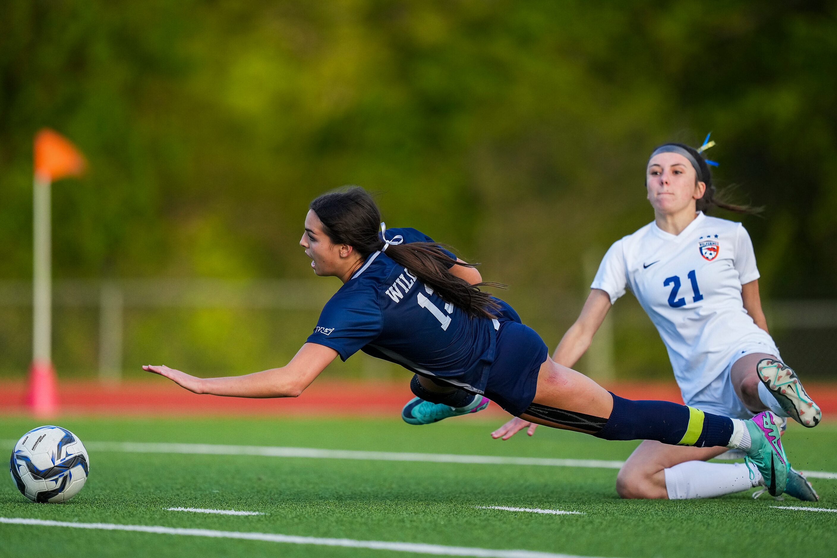 Prosper Walnut Grove midfielder Gianna Wilbur (13) falls to the turf against Frisco...