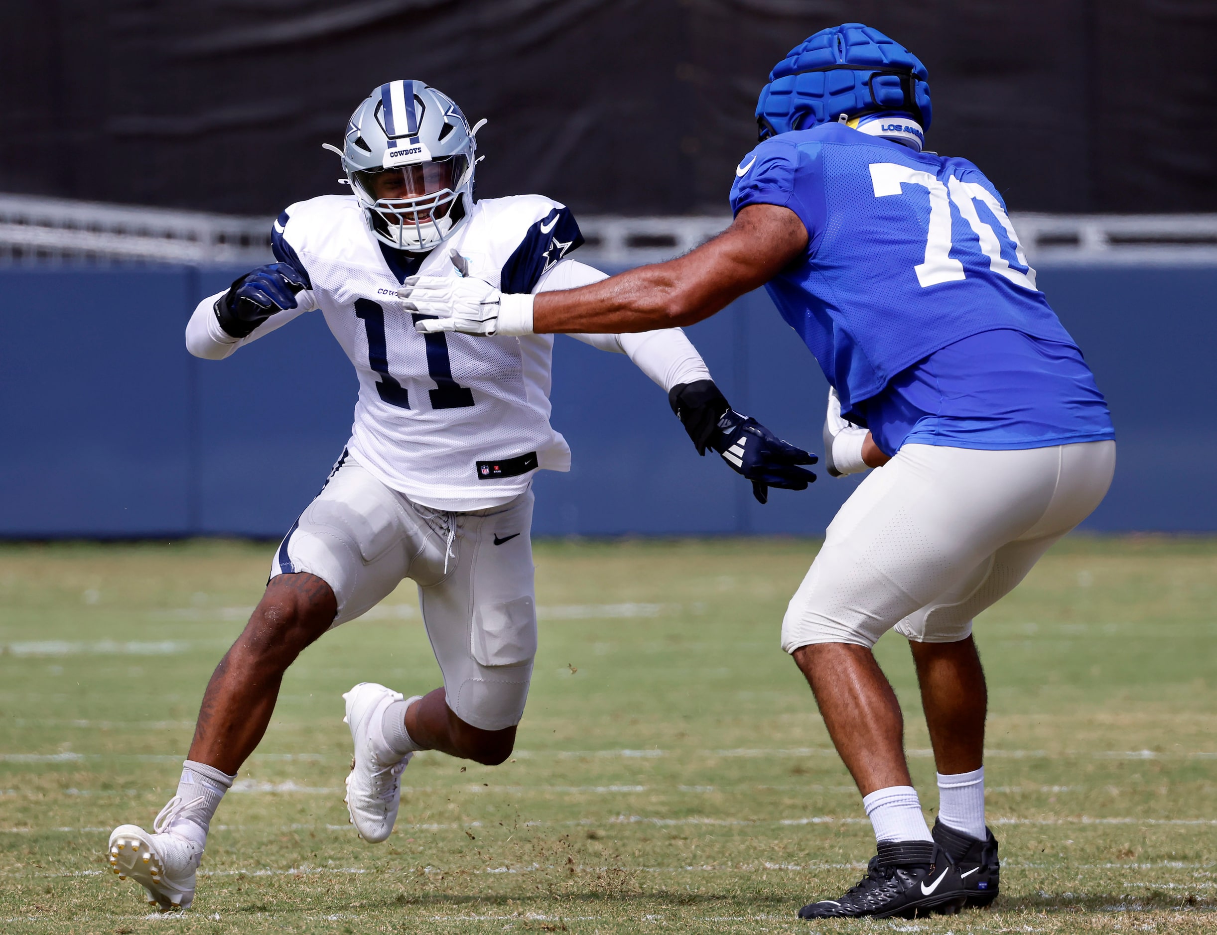 Dallas Cowboys linebacker Micah Parsons (11) races to get around Los Angeles Rams offensive...