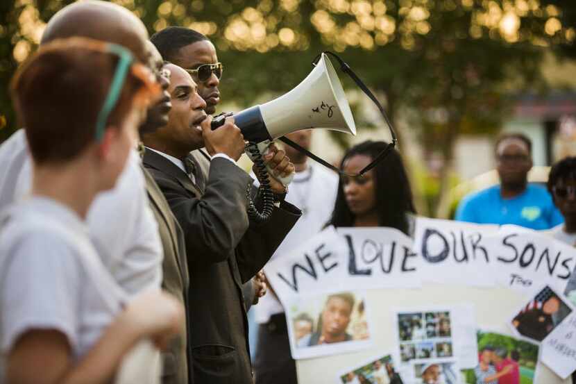 Lee Muhammad, of the Nation of Islam, spoke during a protest outside the Arlington Police...
