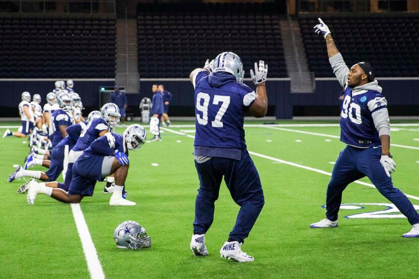 Dallas Cowboys defensive tackle Terrell McClain (97) and defensive end Demarcus Lawrence...