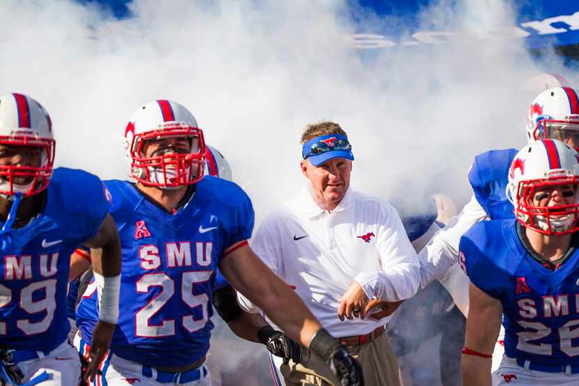 SMU head coach Chad Morris takes the field before an NCAA football game against Baylor at...